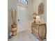 Entryway featuring a decorative table and a white door at 23415 Waverly Cir, Venice, FL 34293