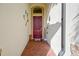 Exterior front door with brick flooring, and welcome decorations at 23415 Waverly Cir, Venice, FL 34293