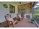 Lanai with brick pavers, outdoor kitchen and view of tropical foliage at 23415 Waverly Cir, Venice, FL 34293