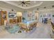 Bright living room with tile flooring, eclectic decor, and open floor plan creates an inviting atmosphere at 23415 Waverly Cir, Venice, FL 34293