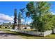 Wide open and spacious backyard enclosed with a white vinyl fence, offering plenty of room for recreation and relaxation at 23495 Altman Ave, Punta Gorda, FL 33980