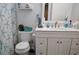 This bathroom features a vanity with white cabinets and countertop, and a shower curtain with blue starfish at 23495 Altman Ave, Punta Gorda, FL 33980