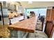 Kitchen island with tiled bar and seating featuring modern appliances and bar seating at 23495 Altman Ave, Punta Gorda, FL 33980