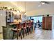 Spacious kitchen with a breakfast bar, tile backsplash, and modern appliances at 23495 Altman Ave, Punta Gorda, FL 33980
