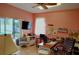 Bright home office featuring a sliding door to the backyard and ample desk space at 23495 Altman Ave, Punta Gorda, FL 33980