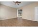 Bedroom with a ceiling fan and sliding doors leading to the backyard at 2487 Morton Rd, North Port, FL 34291