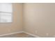 This bedroom has neutral walls and light-colored wood floors, plus a window at 2487 Morton Rd, North Port, FL 34291