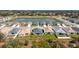 Back aerial view of a one-story house near a pond in a suburban community at 2572 Averland Loop, North Port, FL 34287