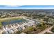 Single-story home near a pond, surrounded by well-kept lawns and sidewalks at 2572 Averland Loop, North Port, FL 34287