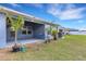 Covered patio and well-maintained backyard, perfect for outdoor entertaining and relaxation at 2572 Averland Loop, North Port, FL 34287