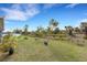 Expansive backyard featuring lush greenery, creating a private and peaceful outdoor oasis at 2572 Averland Loop, North Port, FL 34287