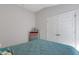 Empty bedroom showing a double closet, modern dresser and large window at 2572 Averland Loop, North Port, FL 34287