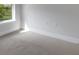 Bright room showcasing neutral carpet, white baseboards, and ample light at 2572 Averland Loop, North Port, FL 34287