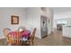 Cozy dining area featuring hardwood floors and a stainless steel refrigerator at 2572 Averland Loop, North Port, FL 34287