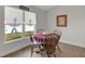 Bright dining area with natural light and hardwood floors at 2572 Averland Loop, North Port, FL 34287