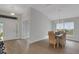 Bright dining area complemented by stylish hardwood floors at 2572 Averland Loop, North Port, FL 34287