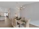 Formal dining room features hardwood floors and contemporary lighting at 2572 Averland Loop, North Port, FL 34287