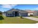 Charming single-story home with a well-manicured lawn and inviting curb appeal at 2572 Averland Loop, North Port, FL 34287