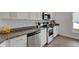Well-equipped kitchen with stainless steel appliances, granite countertops, and ample counter space at 2572 Averland Loop, North Port, FL 34287