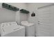 Functional laundry room with modern appliances and ample storage space at 2572 Averland Loop, North Port, FL 34287