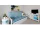 Relaxing living room featuring a futon sofa, tropical decor, and a TV stand at 2572 Averland Loop, North Port, FL 34287