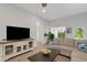 Comfortable living area with stylish entertainment center and decorative accents at 2572 Averland Loop, North Port, FL 34287