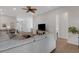 Open living space with views to the kitchen, dining room, and entry at 2572 Averland Loop, North Port, FL 34287