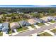 A birds eye street view of a modern, single-story home with manicured lawn at 2572 Averland Loop, North Port, FL 34287