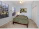 Well-lit bedroom with a bed and ample natural light from a window at 2602 Ravinia Cir # 2602, Venice, FL 34292