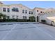 Exterior view showcasing the home and assigned parking spaces at 2602 Ravinia Cir # 2602, Venice, FL 34292