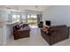 Spacious living room showcasing comfortable furnishings and access to a screened lanai at 2602 Ravinia Cir # 2602, Venice, FL 34292