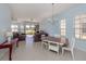Open living area with tile floors, comfortable seating, and views of the golf course at 2602 Ravinia Cir # 2602, Venice, FL 34292
