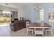 Comfortable living room with tile floors, plush seating, and a dining area at 2602 Ravinia Cir # 2602, Venice, FL 34292
