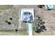 Aerial view of the home showing the backyard layout with a caged pool and lounging area at 2783 Biscayne Dr, North Port, FL 34287