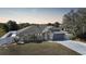 Exterior elevation of a one-story home with a two car garage, a well-maintained lawn, and curb appeal at 2783 Biscayne Dr, North Port, FL 34287