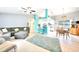 Open living space with kitchen, dining area, and comfortable living room seating with plenty of natural light at 2783 Biscayne Dr, North Port, FL 34287