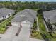 Well maintained home featuring a two car garage, lovely landscaping, and mature trees at 29692 Niagara Ct, Englewood, FL 34223