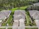 Beautiful home with lush landscaping, spacious driveway, and a well-maintained yard at 29692 Niagara Ct, Englewood, FL 34223