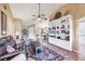 Open floor plan with views of living room, dining area, and kitchen with tile floors at 311 Pembroke Dr # 217, Venice, FL 34293