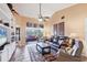 Open floor plan from living room to screened-in lanai overlooking the water with comfortable seating at 311 Pembroke Dr # 217, Venice, FL 34293