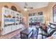 Living room boasts built-in shelving, neutral paint, and an oversized opening to the screened lanai at 311 Pembroke Dr # 217, Venice, FL 34293