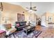 Spacious living room with tile flooring, high ceilings, and neutral paint and decor at 311 Pembroke Dr # 217, Venice, FL 34293