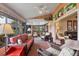 Cozy sunroom retreat featuring comfortable seating, charming decor, and tranquil garden views at 311 Pembroke Dr # 217, Venice, FL 34293