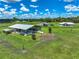 Expansive farm featuring barns, sheds, and well-maintained grounds, ideal for agricultural pursuits and serene living at 35960 State Road 70 E, Myakka City, FL 34251