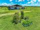 Charming garden area with raised beds and archway, adding character and potential for sustainable living at 35960 State Road 70 E, Myakka City, FL 34251