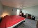 Bedroom featuring plank flooring, a ceiling fan, and window with blinds at 404 Elder St # 230, Englewood, FL 34223