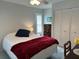 Bedroom with ceiling fan, window with blinds, tiled flooring and closet at 404 Elder St # 230, Englewood, FL 34223