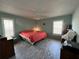 Bedroom featuring plank flooring, a ceiling fan, and window with blinds at 404 Elder St # 230, Englewood, FL 34223
