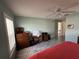Bedroom featuring plank flooring, a ceiling fan, and window with blinds at 404 Elder St # 230, Englewood, FL 34223