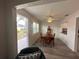 Dining room featuring wood floors and natural light at 404 Elder St # 230, Englewood, FL 34223